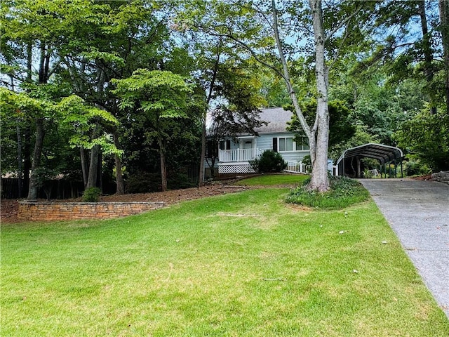 2606 Ramblewood Ct, Acworth, GA 30102 - view of front of home with a front yard, a carport, and covered porch