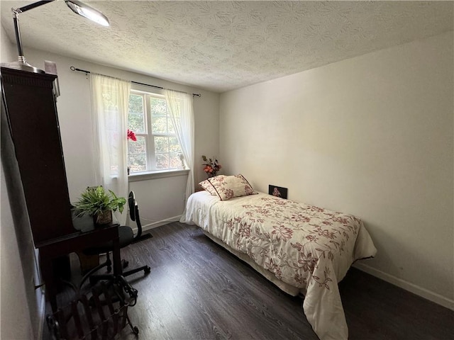 2606 Ramblewood Ct, Acworth, GA 30102 - bedroom featuring dark wood-type flooring and a textured ceiling