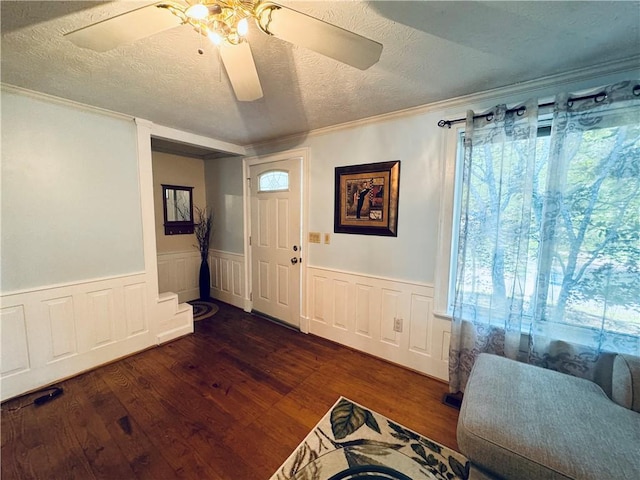 2606 Ramblewood Ct, Acworth, GA 30102 - entrance foyer with ornamental molding, dark hardwood / wood-style flooring, and a textured ceiling