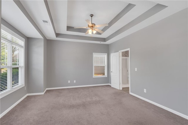 903 Duncan Ter, Canton, GA 30115 - unfurnished bedroom featuring a raised ceiling, carpet flooring, and a ceiling fan