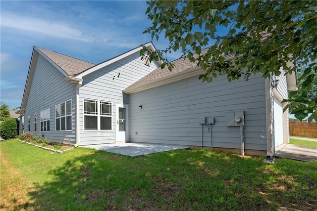 903 Duncan Ter, Canton, GA 30115 - back of property with a lawn, a patio, a garage, and a shingled roof