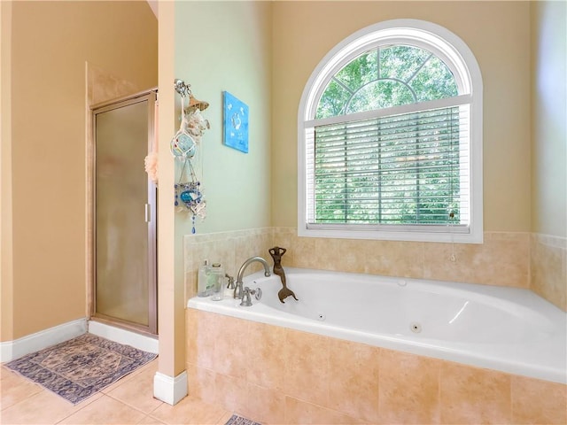 bathroom featuring tile patterned flooring and plus walk in shower