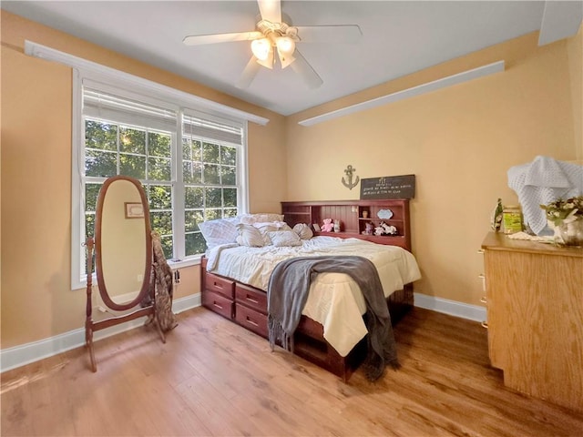 bedroom with wood-type flooring and ceiling fan