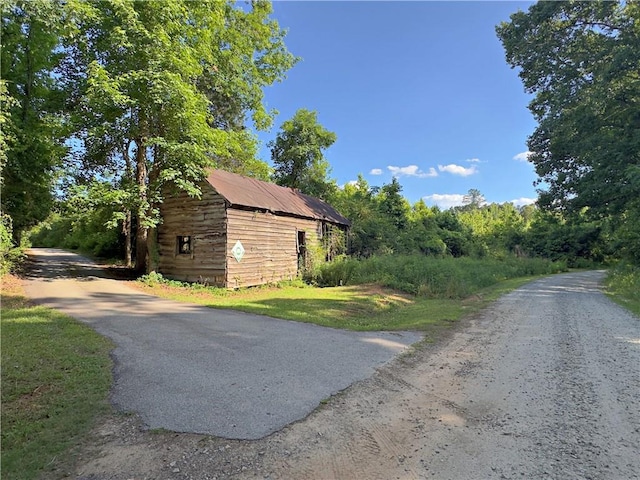 view of home's exterior featuring an outbuilding