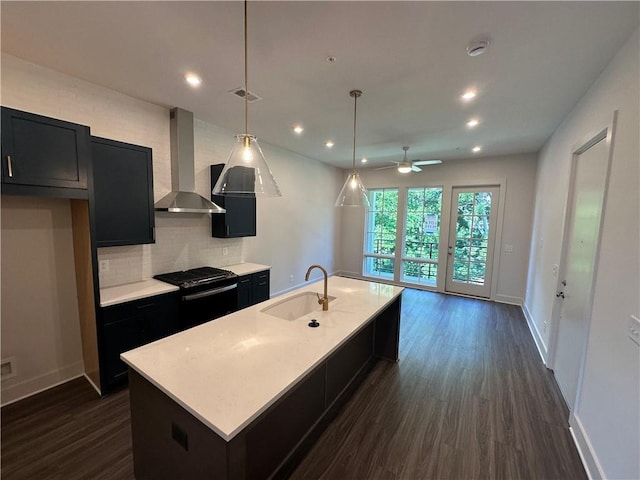 962 Bibbs Cir NW Unit 6, Atlanta, GA 30318 - kitchen featuring wall chimney exhaust hood, a sink, black range with gas stovetop, dark cabinetry, and recessed lighting