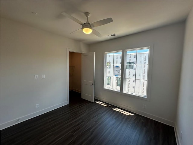 962 Bibbs Cir NW Unit 6, Atlanta, GA 30318 - unfurnished room featuring dark wood-style flooring, baseboards, and a ceiling fan