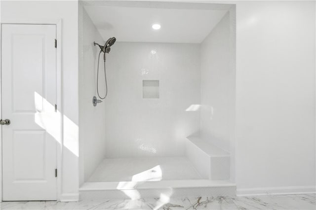 bathroom with a tile shower