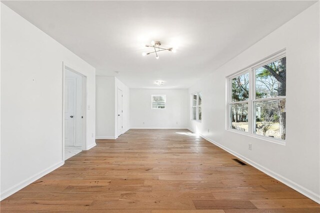 spare room with light hardwood / wood-style flooring