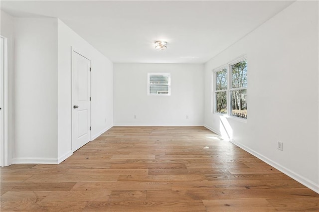 unfurnished room with light hardwood / wood-style floors