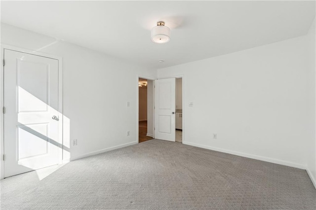 empty room featuring light colored carpet