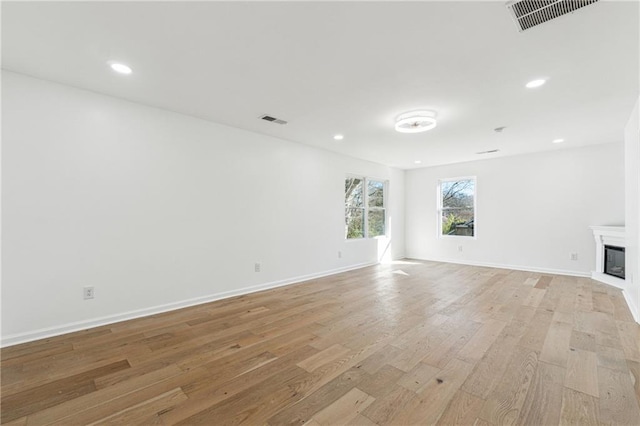 unfurnished living room with light wood-type flooring