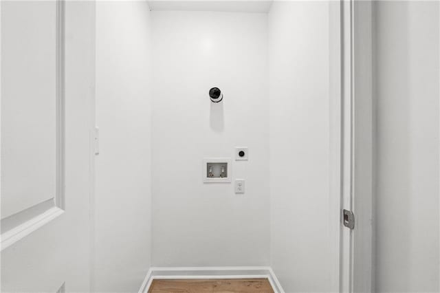 laundry room with electric dryer hookup, hardwood / wood-style floors, and hookup for a washing machine