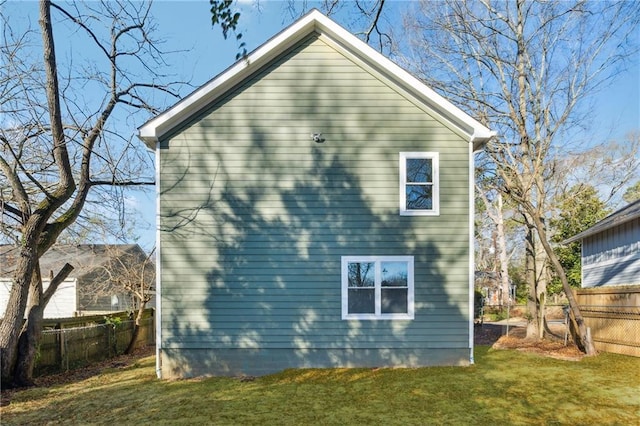 rear view of property with a yard