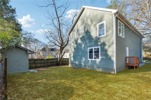 rear view of property with a lawn