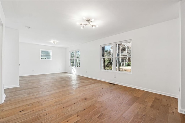 unfurnished room featuring light hardwood / wood-style flooring