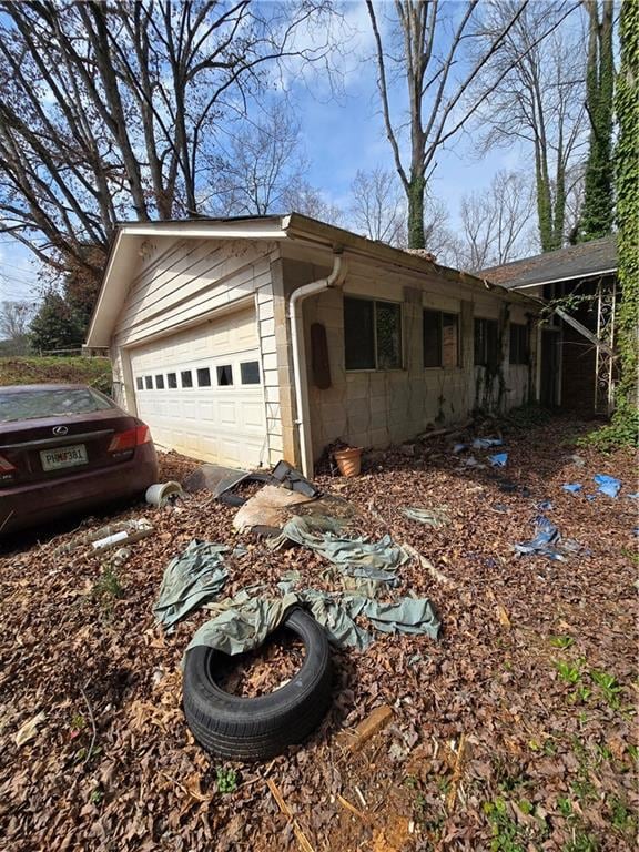 view of home's exterior featuring an attached garage