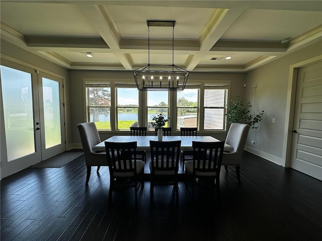 2657 Gray Mill Way, Loganville, GA 30052 - dining area featuring a chandelier, plenty of natural light, baseboards, coffered ceiling, and a water view