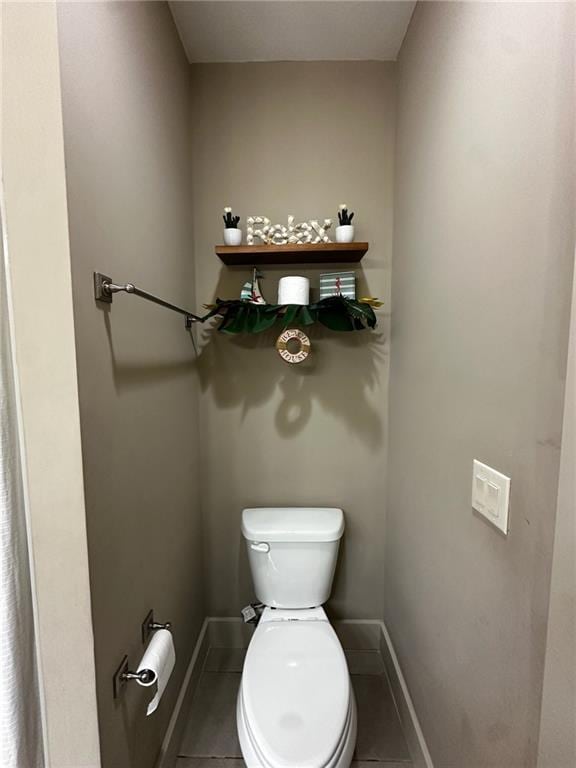 2657 Gray Mill Way, Loganville, GA 30052 - bathroom with toilet, baseboards, and tile patterned flooring