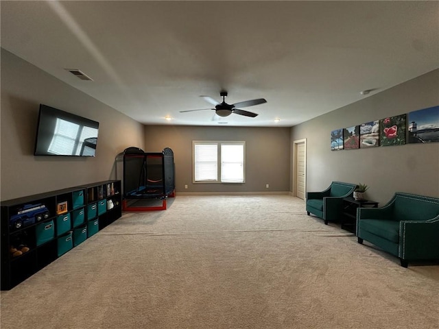 2657 Gray Mill Way, Loganville, GA 30052 - living room featuring carpet, ceiling fan, and baseboards