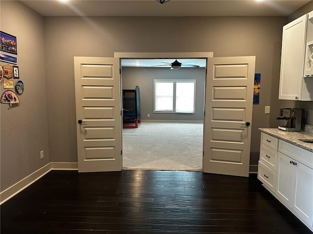 2657 Gray Mill Way, Loganville, GA 30052 - kitchen featuring ceiling fan, white cabinetry, and light stone countertops