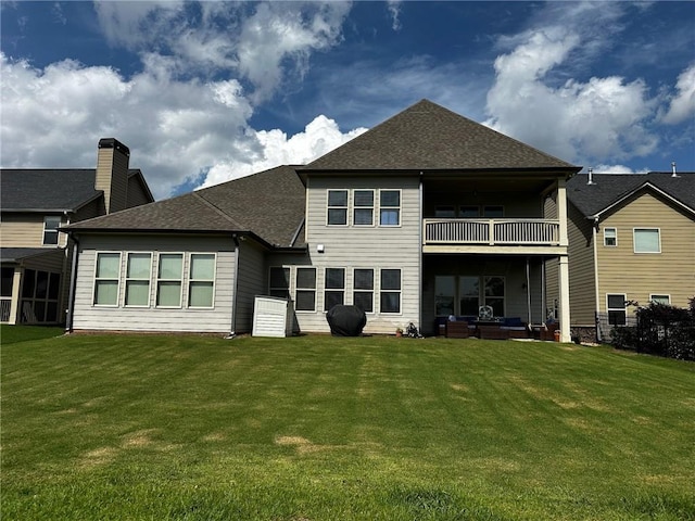 2657 Gray Mill Way, Loganville, GA 30052 - back of property featuring a balcony, outdoor lounge area, a lawn, and roof with shingles