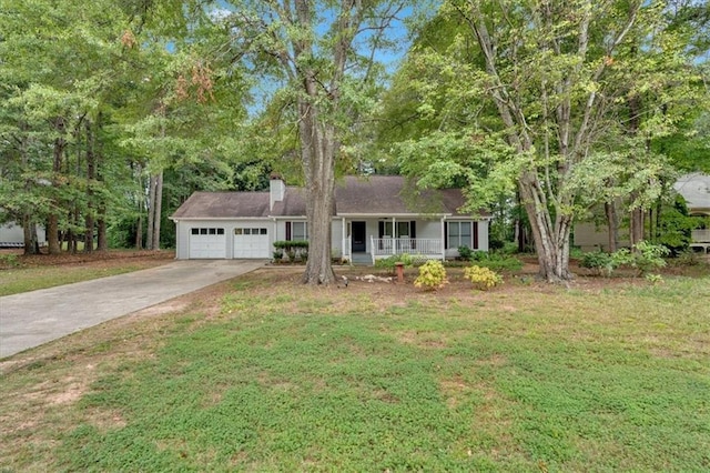 view of front of home featuring a garage, a porch, and a front yard