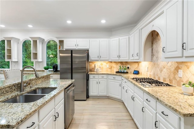 790 Thornberry Dr, Alpharetta, GA 30022 - kitchen featuring a sink, stainless steel appliances, white cabinets, light wood-style flooring, and open shelves