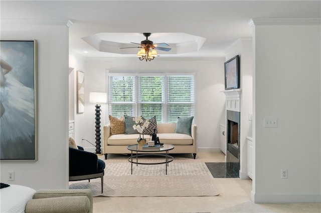790 Thornberry Dr, Alpharetta, GA 30022 - living room with crown molding, ceiling fan, a tray ceiling, a fireplace with flush hearth, and baseboards