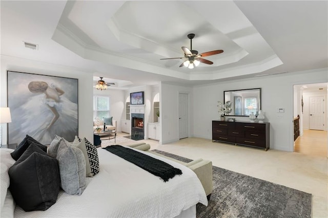 790 Thornberry Dr, Alpharetta, GA 30022 - bedroom featuring a raised ceiling, ornamental molding, light carpet, a fireplace with flush hearth, and ceiling fan