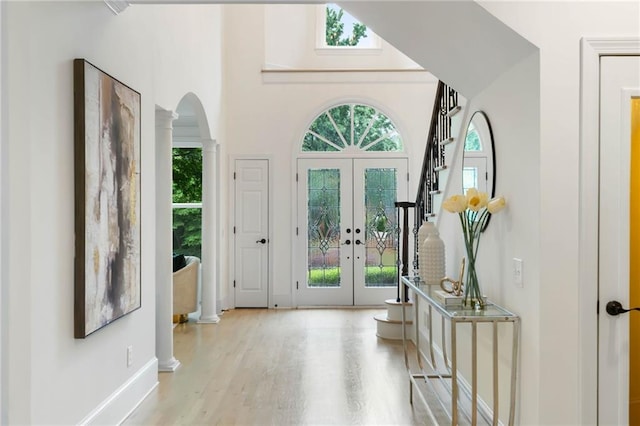 790 Thornberry Dr, Alpharetta, GA 30022 - entrance foyer with decorative columns, french doors, arched walkways, plenty of natural light, and a high ceiling