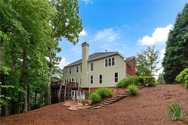 790 Thornberry Dr, Alpharetta, GA 30022 - back of house featuring stairs, a chimney, a wooden deck, and a patio