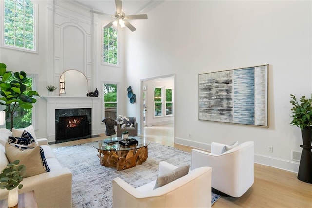 790 Thornberry Dr, Alpharetta, GA 30022 - living area featuring plenty of natural light, wood finished floors, and a towering ceiling