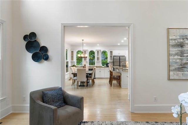 790 Thornberry Dr, Alpharetta, GA 30022 - living area featuring light wood-style flooring, a chandelier, baseboards, and recessed lighting