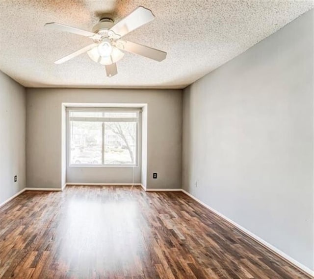 empty room featuring a textured ceiling, hardwood / wood-style flooring, and ceiling fan