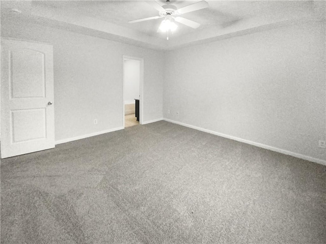 empty room with ceiling fan, carpet flooring, and a textured ceiling