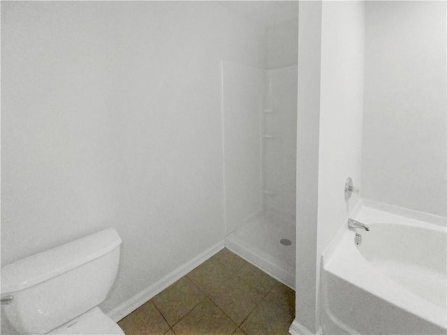 bathroom featuring independent shower and bath, tile patterned flooring, and toilet