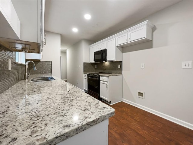 kitchen featuring light stone counters, sink, white cabinetry, black appliances, and dark hardwood / wood-style flooring