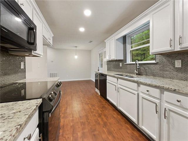 kitchen featuring white cabinets, decorative light fixtures, black appliances, dark hardwood / wood-style floors, and decorative backsplash