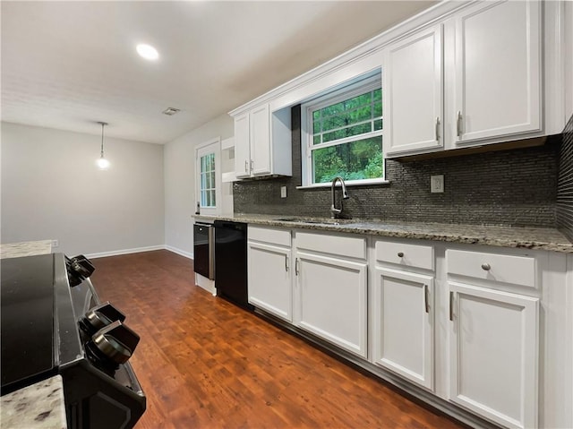 kitchen featuring a wealth of natural light, dishwasher, white cabinets, and dark hardwood / wood-style flooring