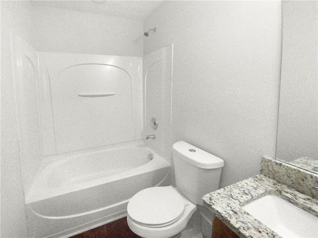 full bathroom with shower / washtub combination, a textured ceiling, vanity, and toilet