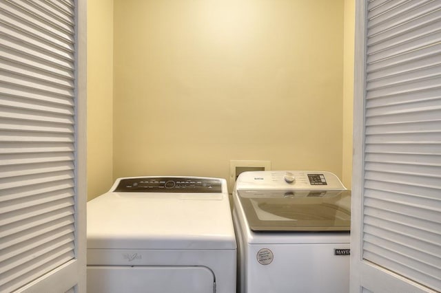 laundry area with washer and clothes dryer and laundry area