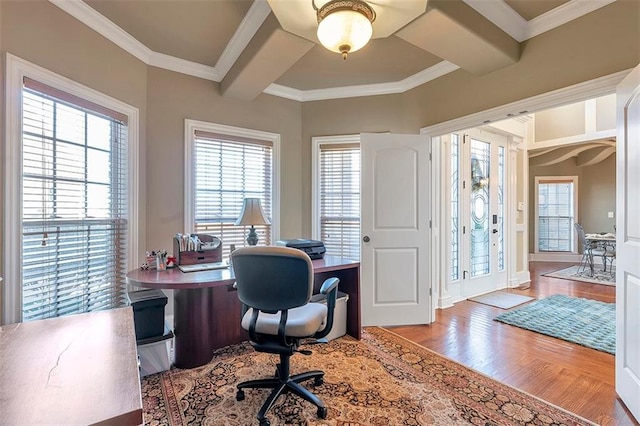 office area featuring beamed ceiling, wood finished floors, and ornamental molding