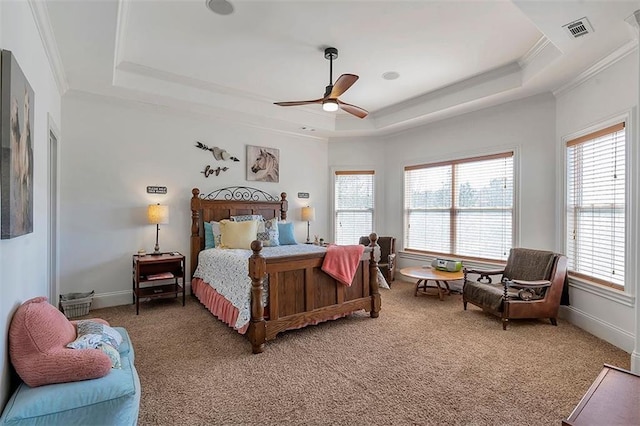 bedroom featuring visible vents, crown molding, ceiling fan, light carpet, and a raised ceiling