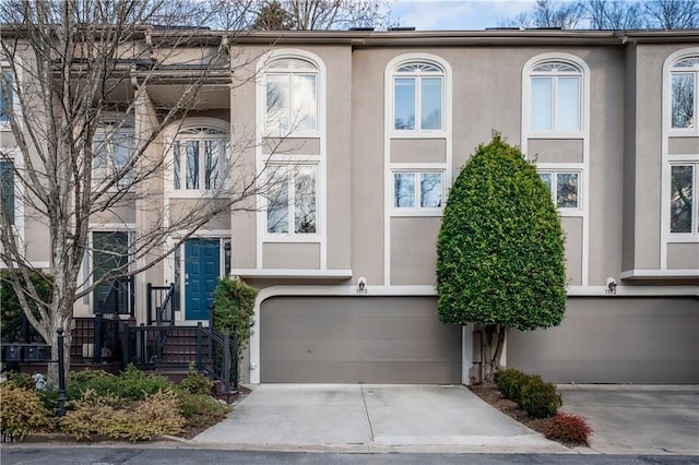 townhome / multi-family property featuring a garage