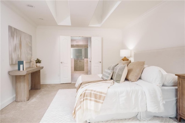 carpeted bedroom featuring crown molding and connected bathroom