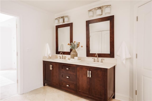 bathroom with vanity, crown molding, and tile patterned floors