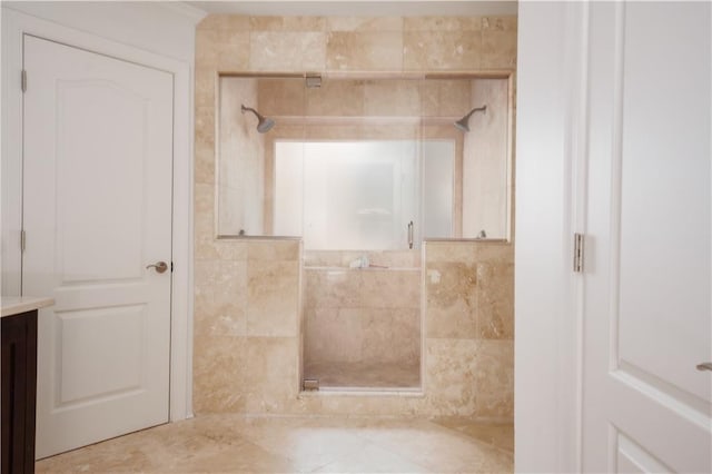 bathroom with a shower with door