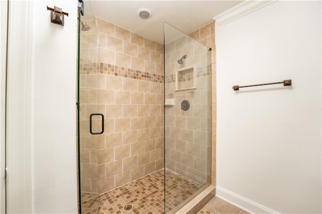 bathroom with a shower with door and tile patterned flooring