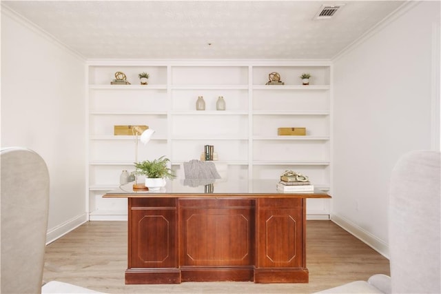 bar with light hardwood / wood-style floors and built in shelves