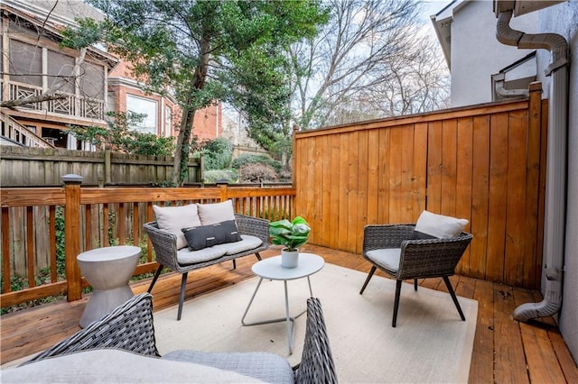 wooden terrace featuring outdoor lounge area